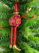 Baumschmuck  Weihnachtsmann mit langen Beinen und einem Geschenk 17 cm rot-gold Christbaumschmuck
