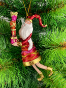 Baumschmuck Weihnachtsmann in einem roten Mantel und Geschenken 15 cm rot-gold Ornament Christbaumschmuck